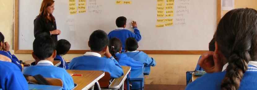 Teaching English on a Volunteer Project with Children in Peru Volunteer teaches a vocabulary lesson in a school in the Sacred Valley of the Incas, Peru